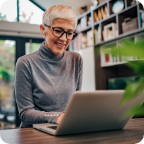 A woman uses her laptop to shop online.   